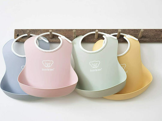 BabyBjorn Soft Impermeabila Bavetă Plastic cu buton & Buzunar Galben pudră 046366