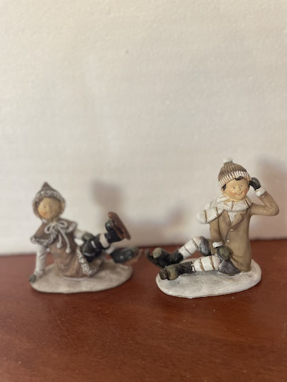 Set of Christmas Figures 1 Girl 1 Boy Sitting Skates