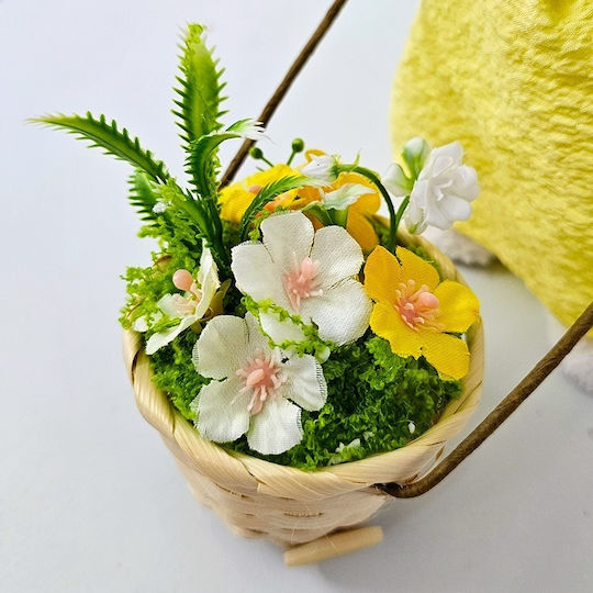 Osterdekorationen Mädchen Kaninchen Korb Blumen