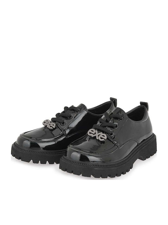 Kinder Slipper & Mokassins aus Schwarz Lackleder