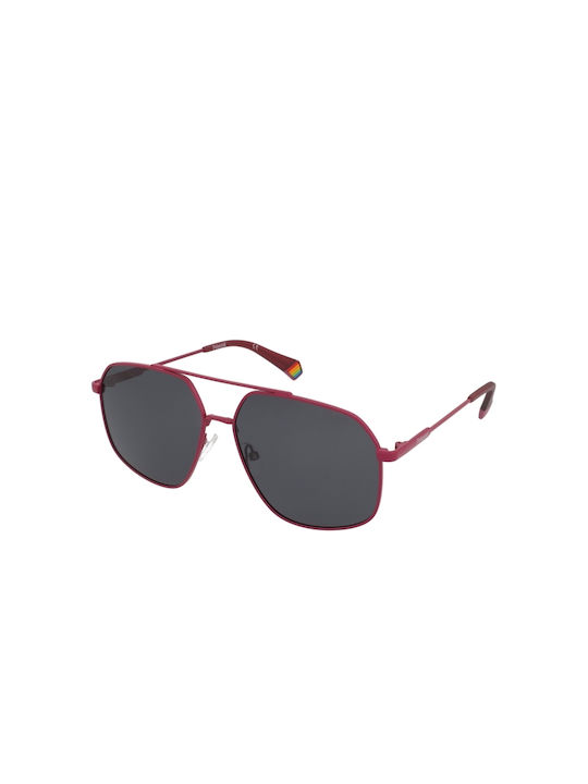 Polaroid Sonnenbrillen mit Rot Rahmen und Schwa...