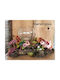 Treibholz-Blumengesteck in Glasvase