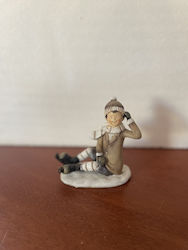 Christmas Figure Boy Sitting Ice Skates