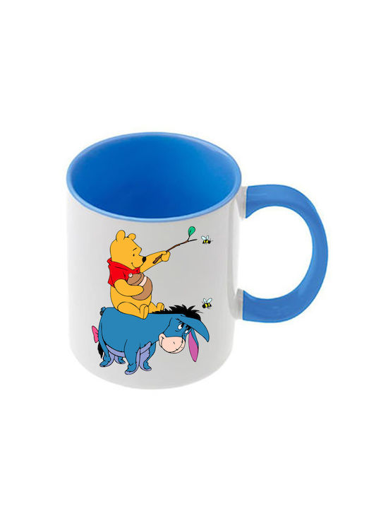 Winnie-Pooh-Tasse mit hellblauem Henkel und hel...
